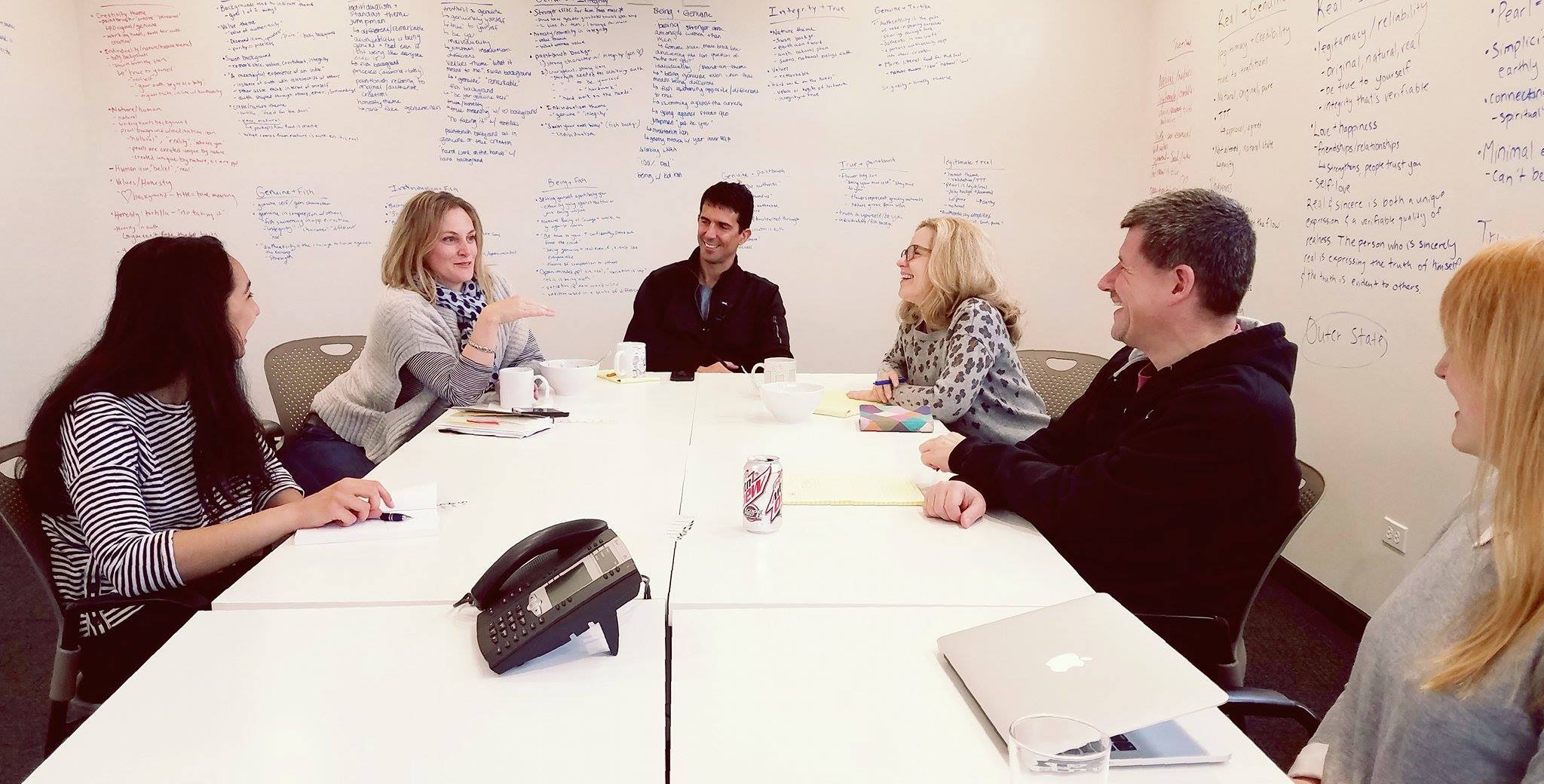 A small group working through a decision together in discussion