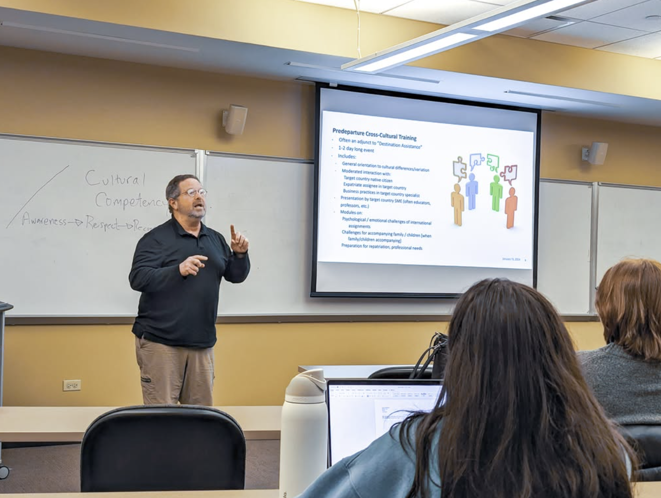 A Sylver facilitator leading a session with a seated audience.