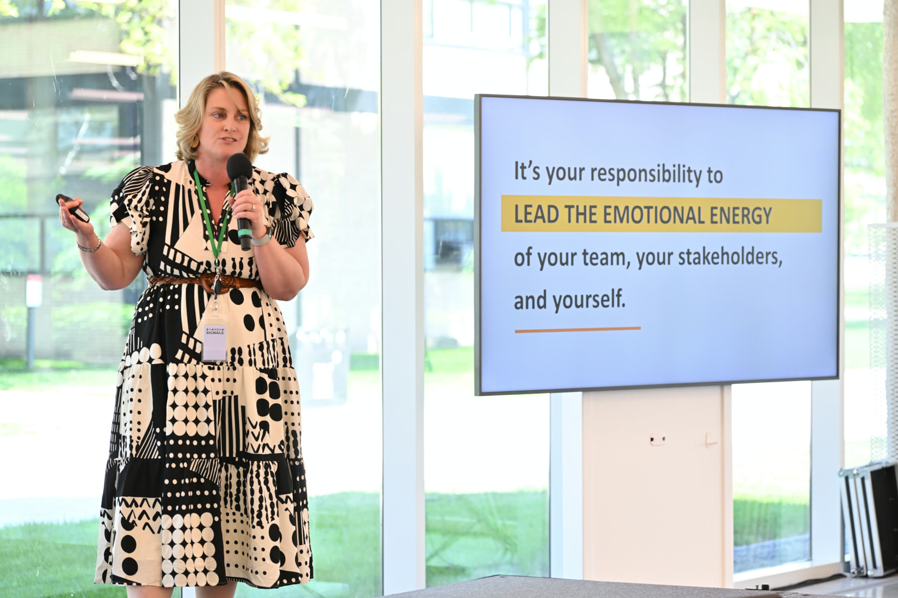 Brianna Sylver on stage presenting the innovation-baggage exercise